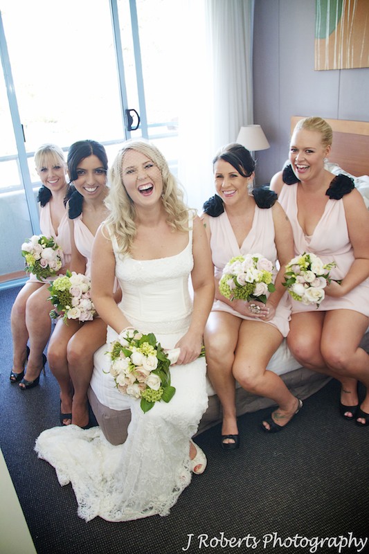 Bride laughing with bridesmaids - wedding photography sydney